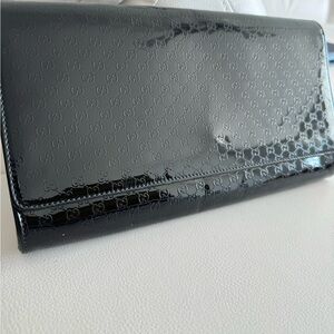 100% authentic Gucci black patent leather clutch